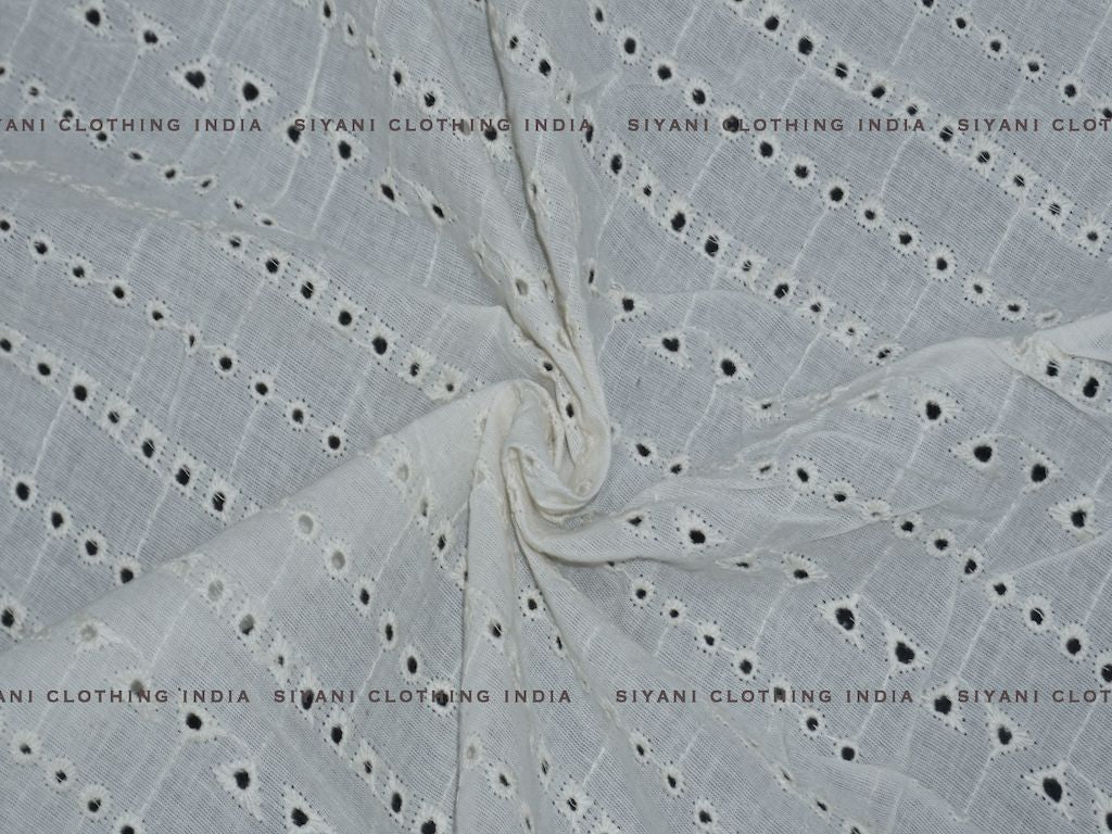 Siyani Kora Cotton Dyeable Cutwork Holes And Triangle Chikankari Embroidered Fabric