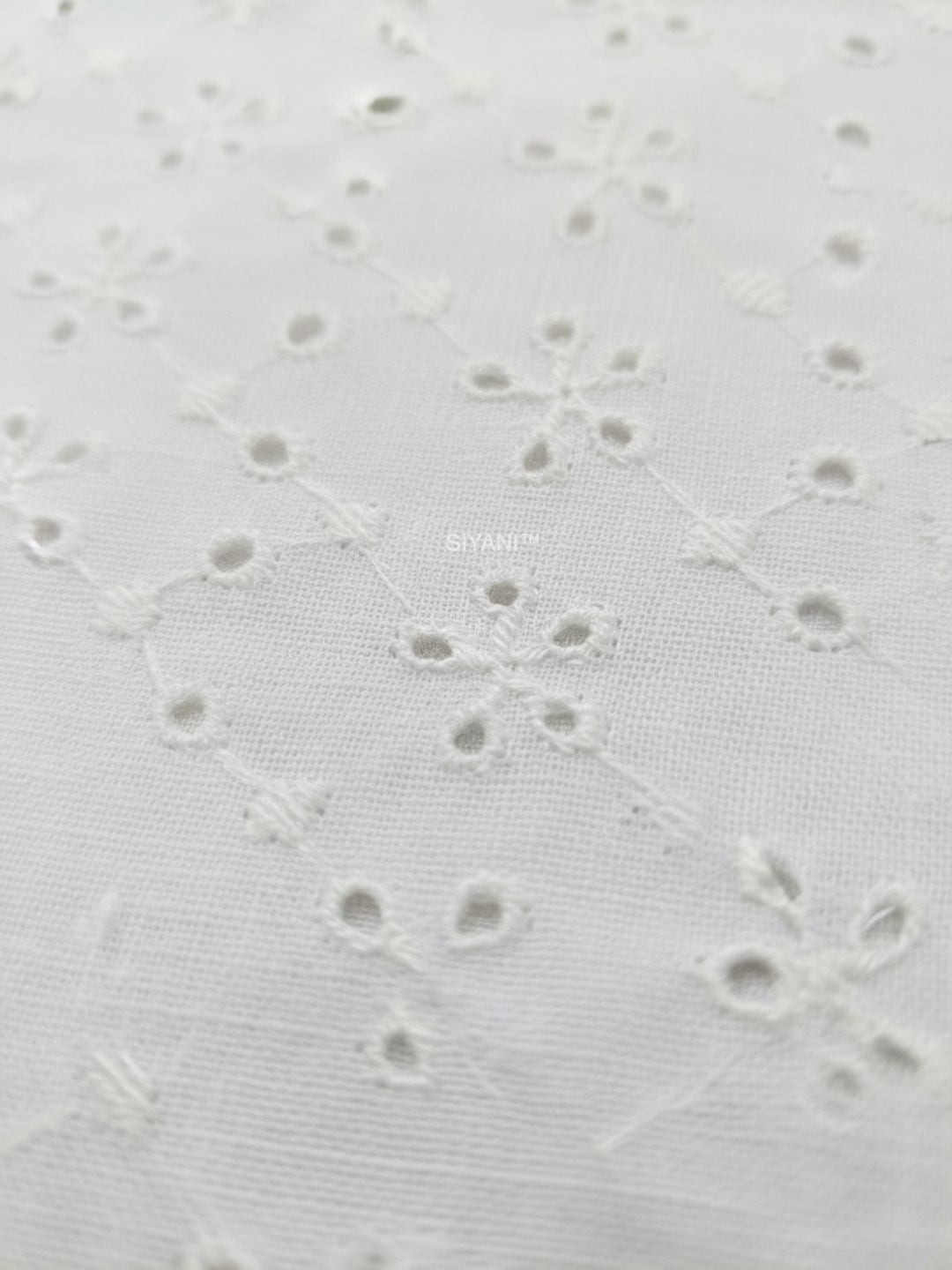 Mini Floral Eyelet Schiffli Embroidered fabric
