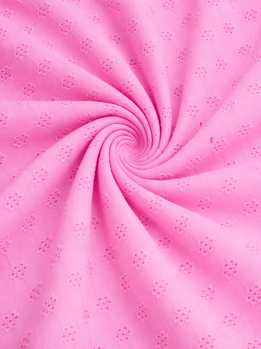 Powder pink floral schiffli embroidered fabric