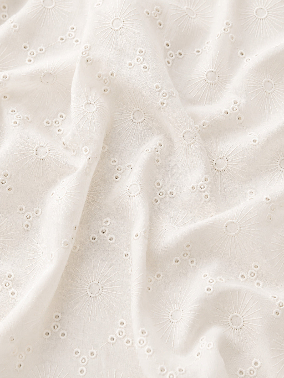 Off White Floral Eyelet Schiffli fabric