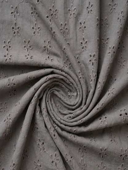 Gray five hole pentagon schiffli fabric