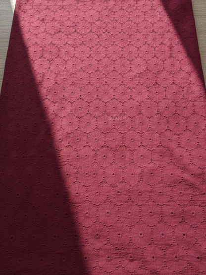 Maroon schiffli eyelet embroidered cotton fabric with geometric floral pattern