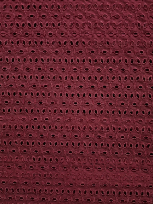 Maroon six hole schiffli embroidered fabric