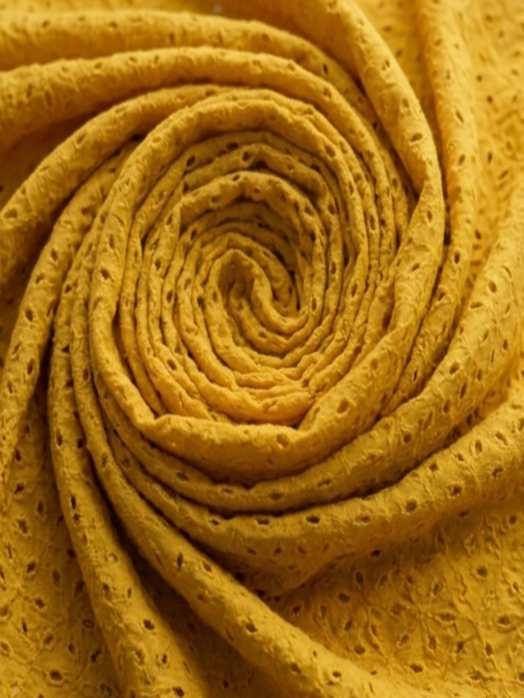 Mustard six hole schiffli embroidered fabric