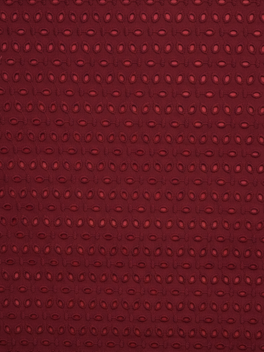 Maroon six hole schiffli embroidered fabric