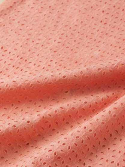 Coral pink six hole schiffli embroidered fabric