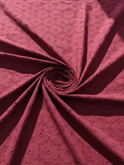 Maroon schiffli eyelet embroidered cotton fabric with geometric floral pattern