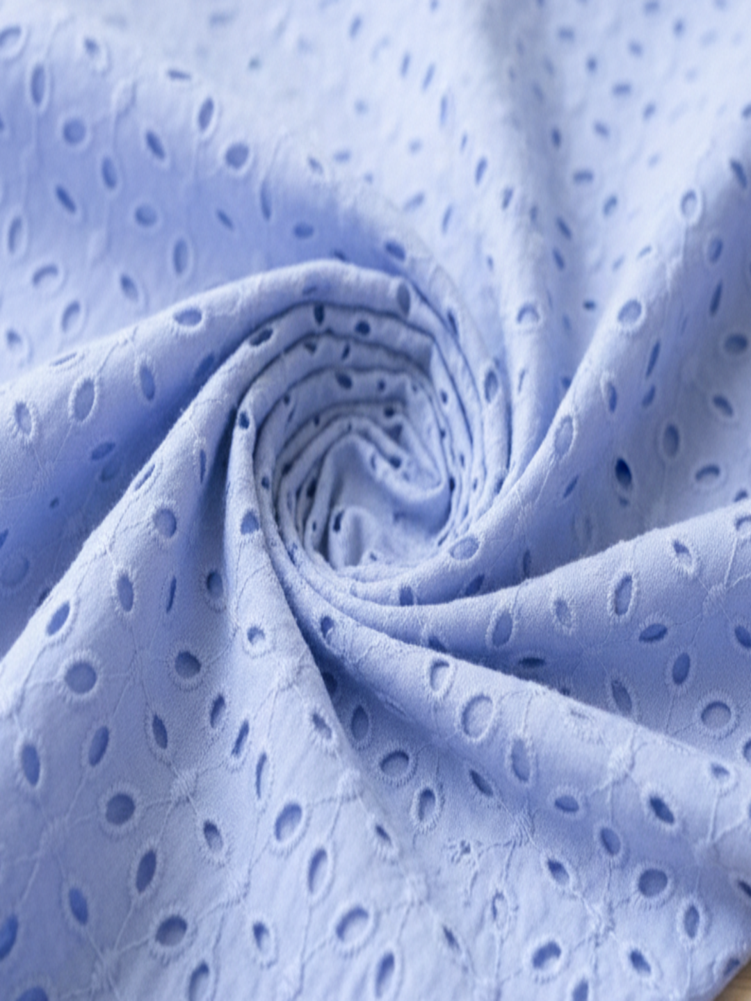 Pastel blue six hole schiffli embroidered fabric
