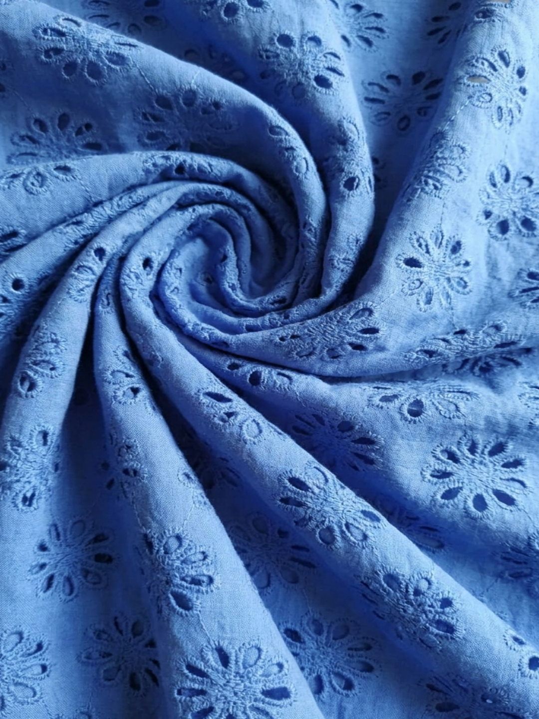 Blue allover floral embroidered fabric