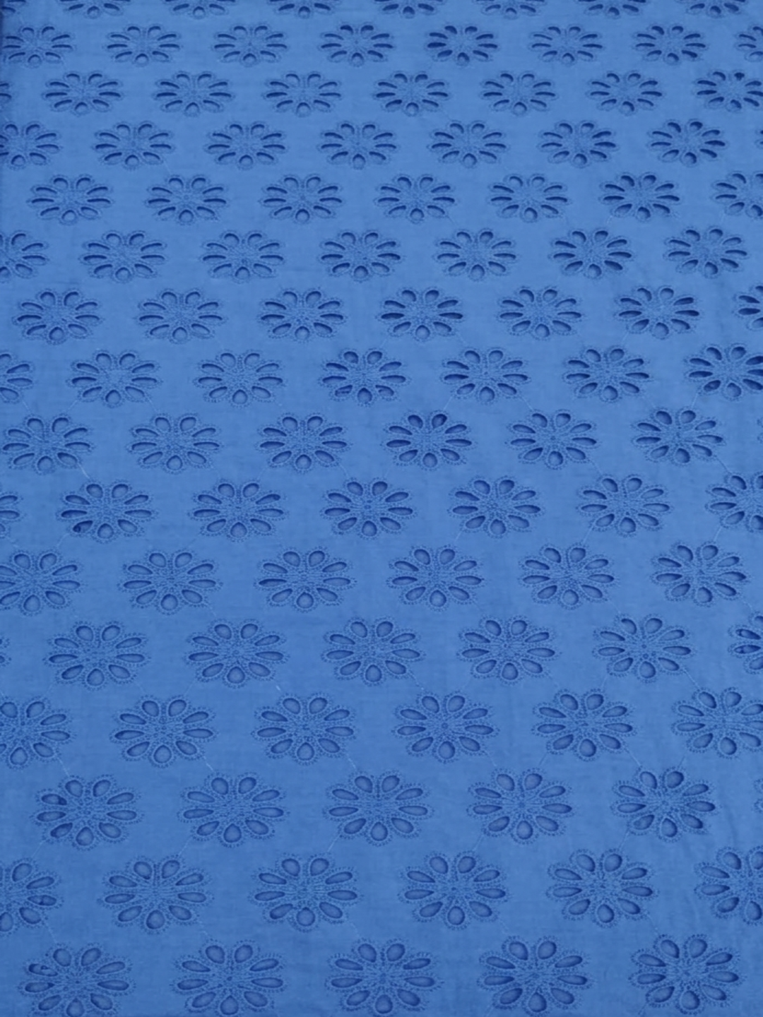 Blue allover floral embroidered fabric