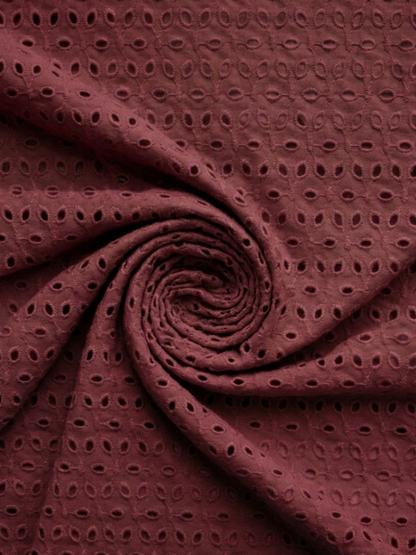 Maroon six hole schiffli embroidered fabric