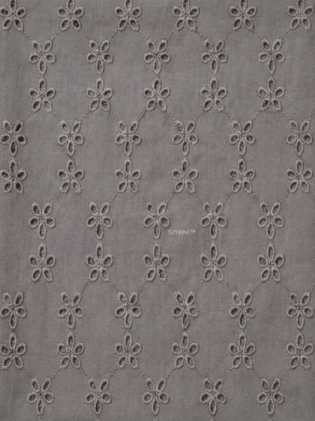 Gray five hole pentagon schiffli fabric