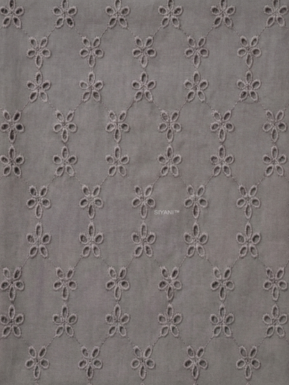 Gray five hole pentagon schiffli fabric