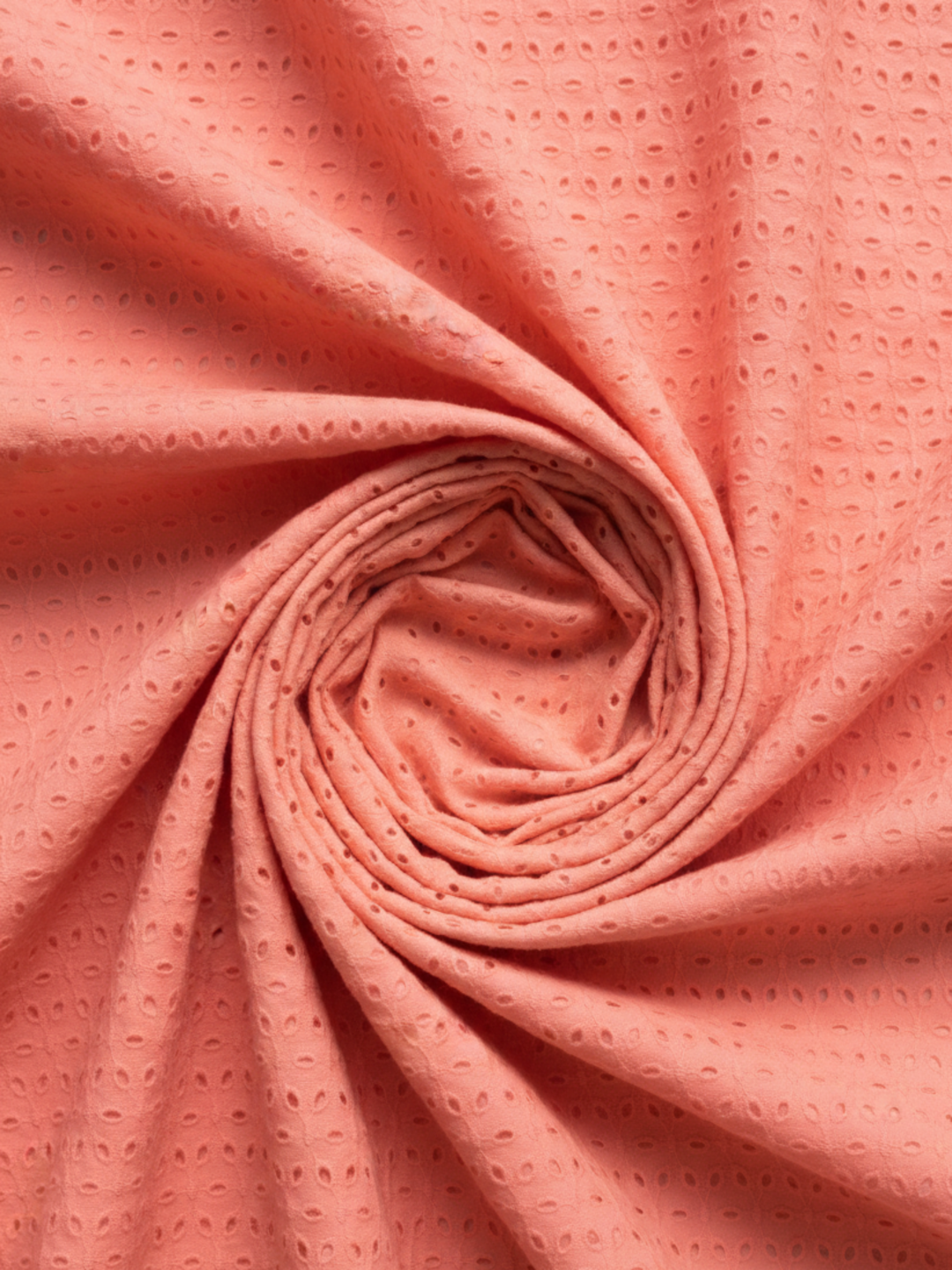 Coral pink six hole schiffli embroidered fabric