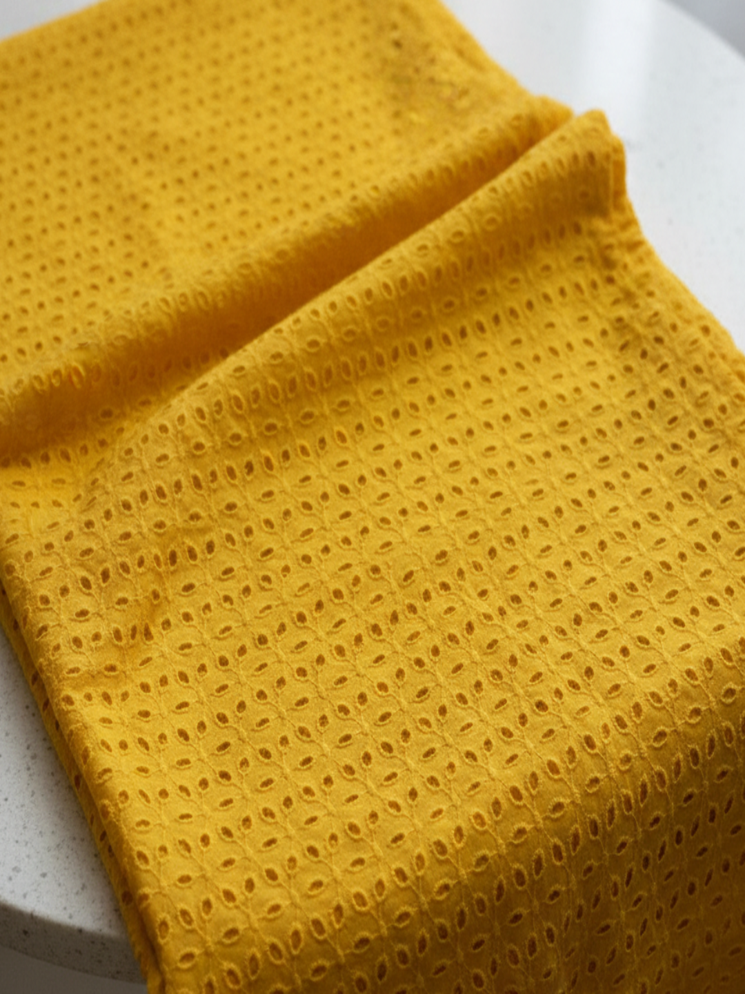 Mustard six hole schiffli embroidered fabric