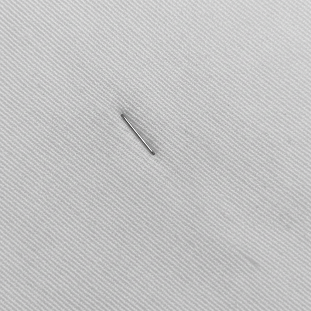 Macro close-up of neel white cotton slub lycra fabric showing diagonal ribbed weave detail