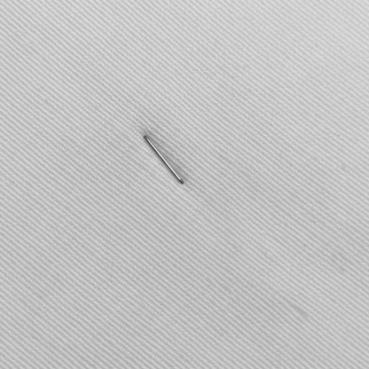 Macro close-up of neel white cotton slub lycra fabric showing diagonal ribbed weave detail