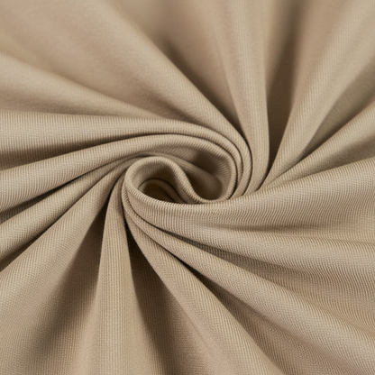 Extreme macro close-up of beige jam cotton fabric showing ribbed twill weave structure and thread detail