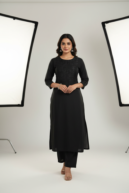 Indian woman wearing elegant black kurti made from Siyani Cotton Cambric Fabric
