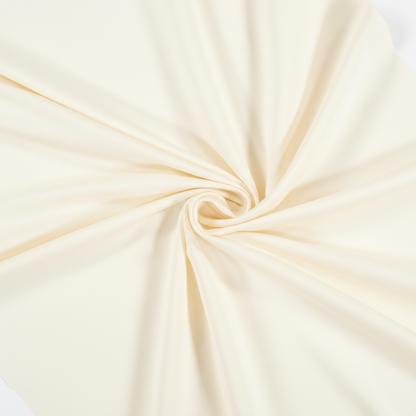 Off white jam cotton fabric in elegant diagonal twill fold hero shot showing natural drape