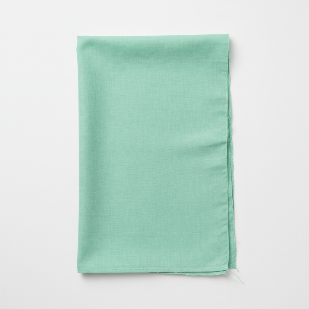 Green Cotton Poplin Fabric flat lay top-down view
