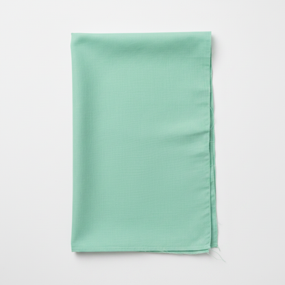 Green Cotton Poplin Fabric flat lay top-down view
