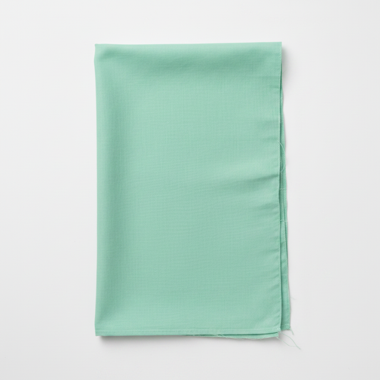 Green Cotton Poplin Fabric flat lay top-down view