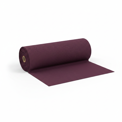 Wine jam cotton fabric rolled as professional thaan bolt with unrolled section displaying ribbed texture