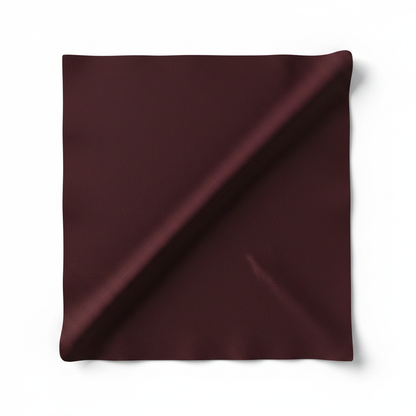 Mahroon rayon slub lycra fabric diagonal fold hero shot showing drape and stretch