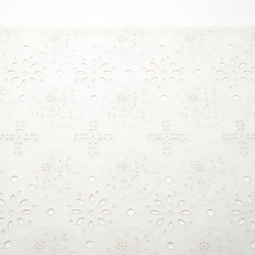 Off-white geometric floral Hakoba cotton Schiffli embroidery fabric with circular medallion and cross cutwork