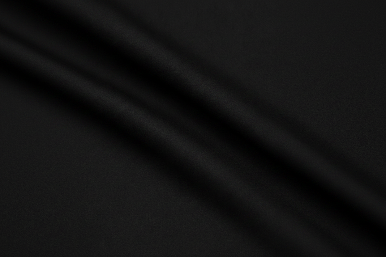 Close-up macro shot of Black Cotton Poplin Lycra Fabric showing fine rib texture and smooth weave