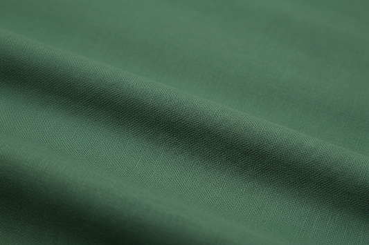 Close-up macro shot of Bottle Green Cotton Poplin Fabric showing fine plain weave texture