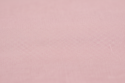 Close-up macro shot of Pink Cotton Cambric Fabric showing fine plain weave texture