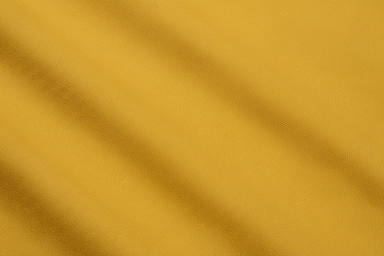 Close-up macro shot of Mustard Cotton Poplin Lycra Fabric showing fine rib texture and smooth weave