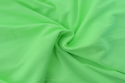 Close-up macro shot of Lime Green Cotton Poplin Lycra Fabric showing fine rib texture and smooth weave