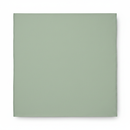 Pistachio green cotton poplin lycra fabric flat lay showing smooth fine weave texture