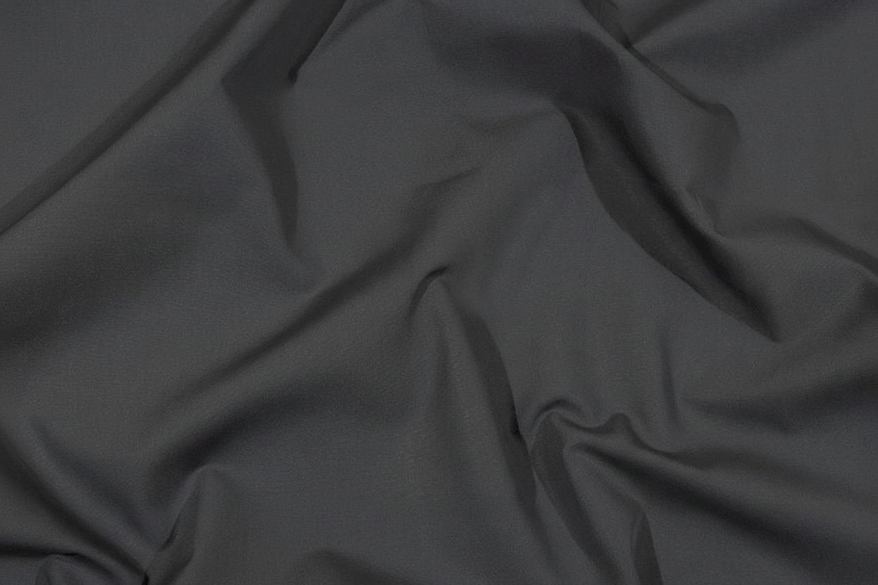 Flat lay of Grey Cotton Poplin Lycra Fabric with measuring tape showing 44 inch width