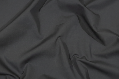 Flat lay of Grey Cotton Poplin Lycra Fabric with measuring tape showing 44 inch width