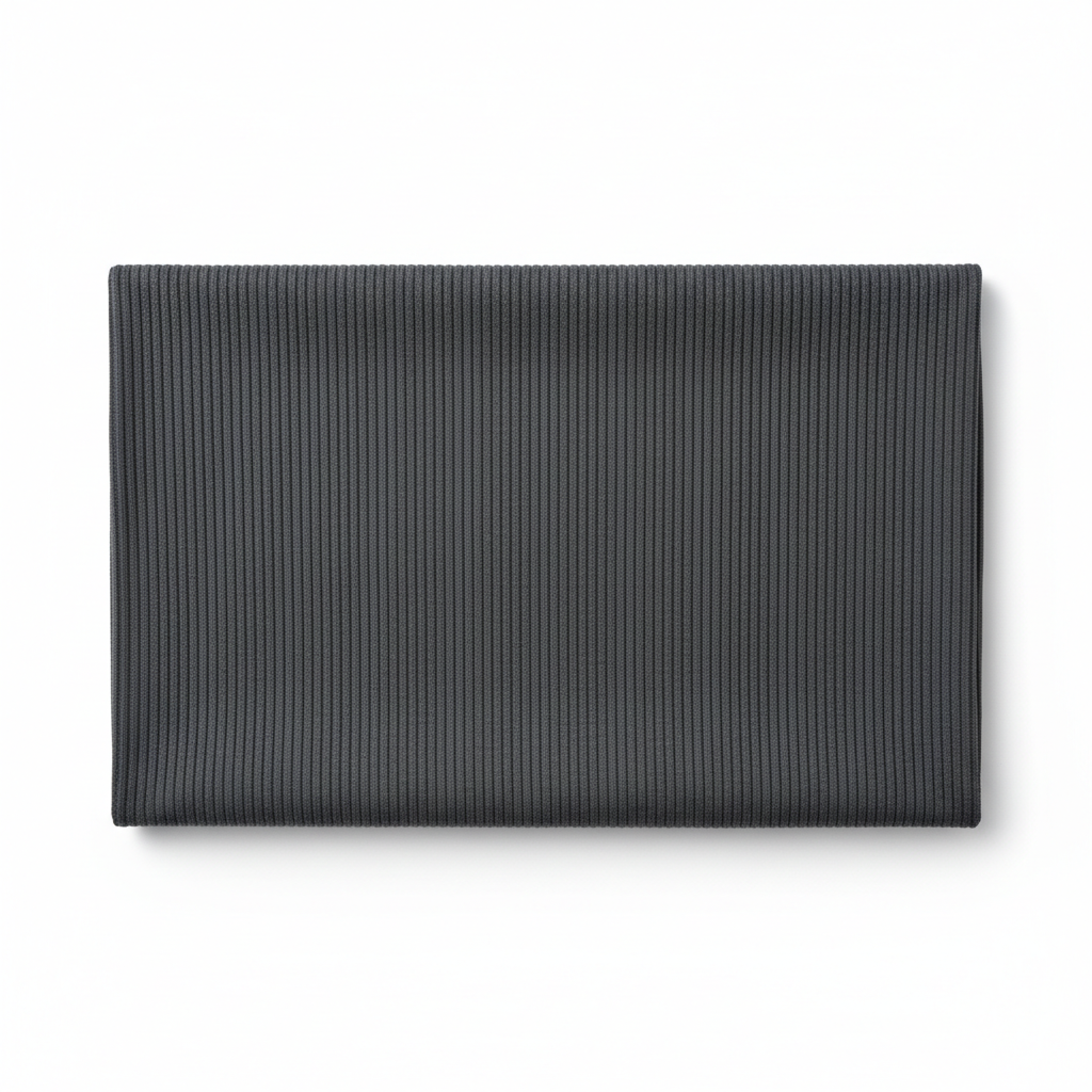 Charcoal grey jam cotton fabric laid completely flat showing full piece and ribbed twill texture
