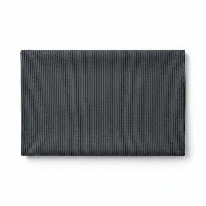 Charcoal grey jam cotton fabric laid completely flat showing full piece and ribbed twill texture