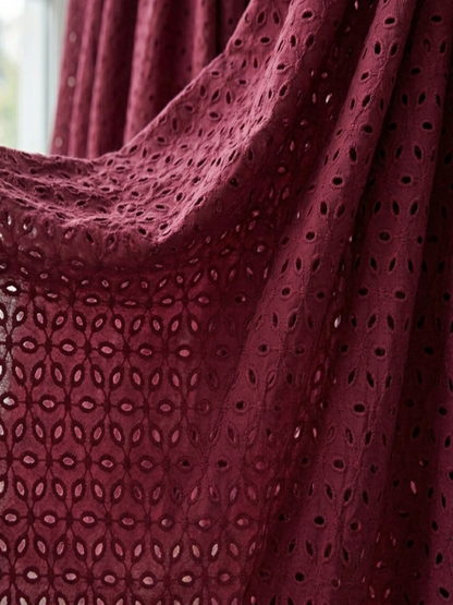 Maroon six hole schiffli embroidered fabric