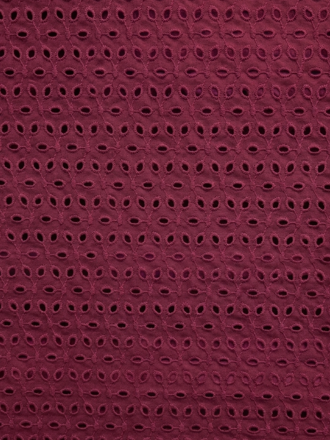 Maroon six hole schiffli embroidered fabric