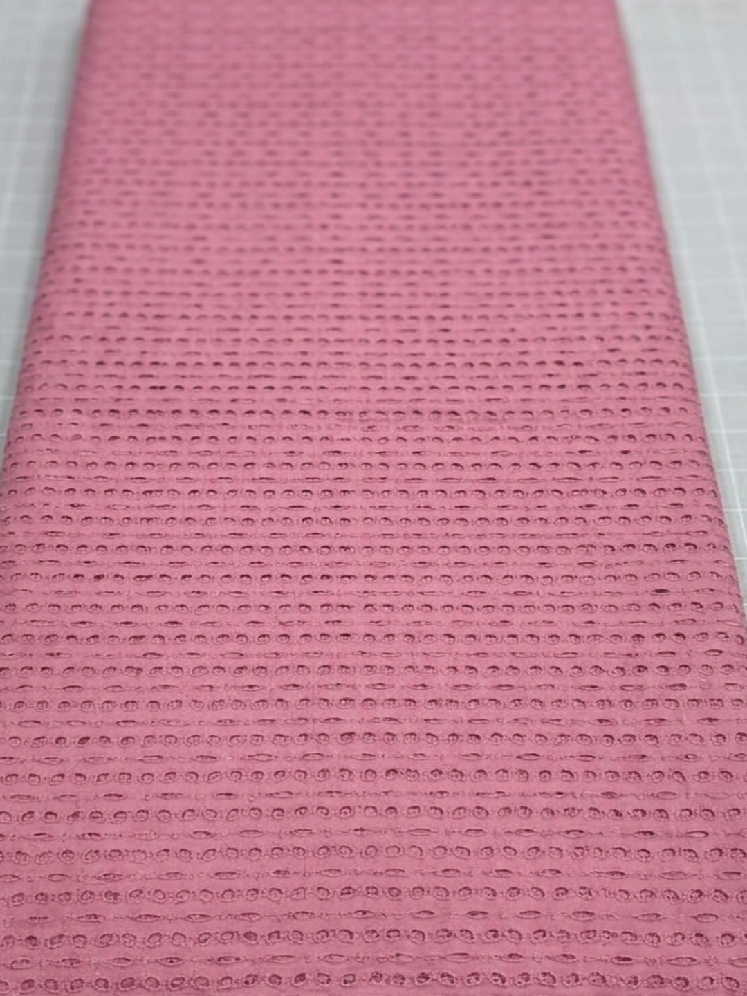 Pink six hole schiffli embroidered fabric