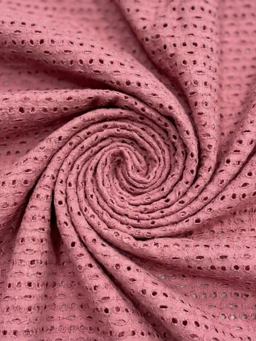 Pink six hole schiffli embroidered fabric