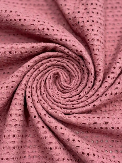 Pink six hole schiffli embroidered fabric