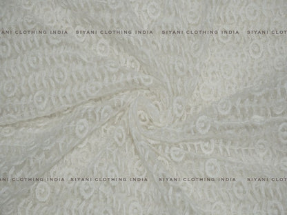 Siyani White Dyeable Circles And Floral Embroidered Net Fabric