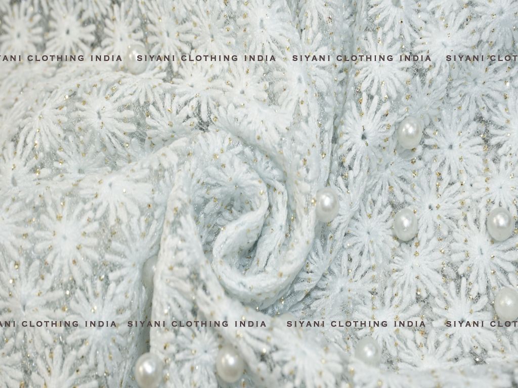 Siyani Sky Blue Thread And Pearl Embroidered Net Fabric