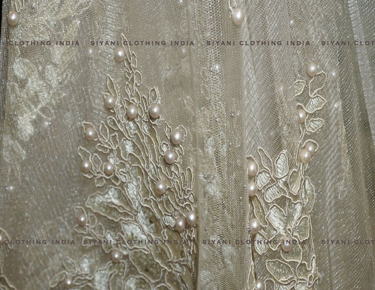 Siyani Golden Floral Thread And Pearl Embroidered Net Fabric